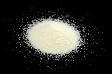 Pile of Semolina on Black Background clipart