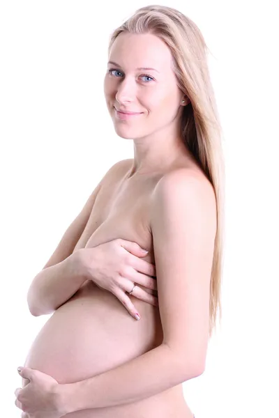 Zwangere vrouw haar taille met tape meten — Stockfoto
