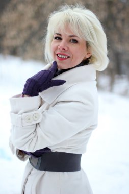 Winter woman in rest snow park