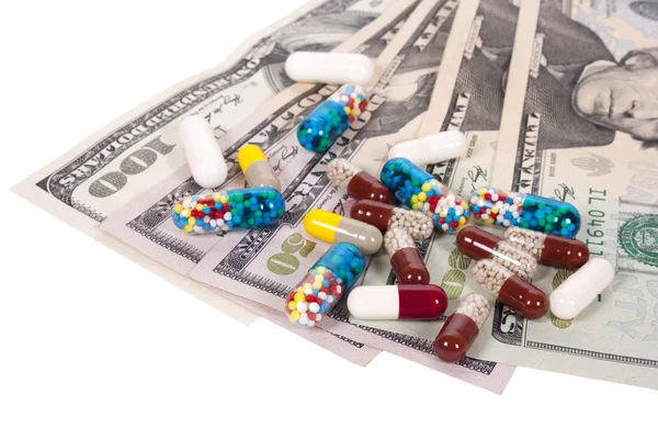 Capsules and US dollars — Stock Photo, Image
