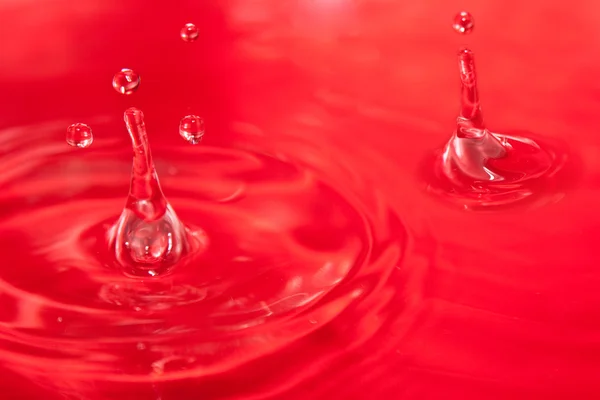 Plusk wody czerwony — Zdjęcie stockowe
