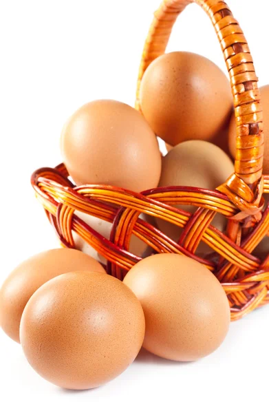 Easter eggs in brown basket — Stock Photo, Image