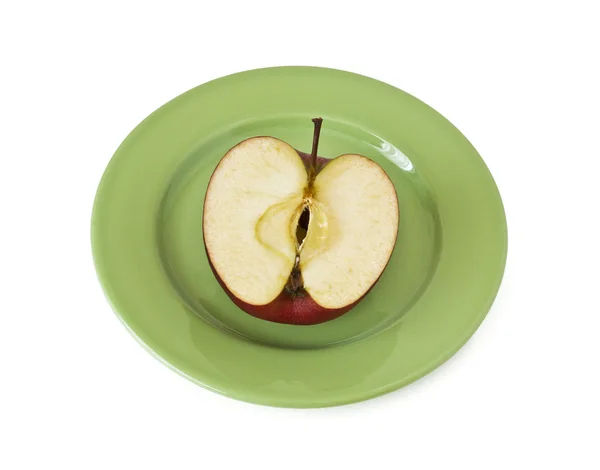 Stock image Half an apple on a plate