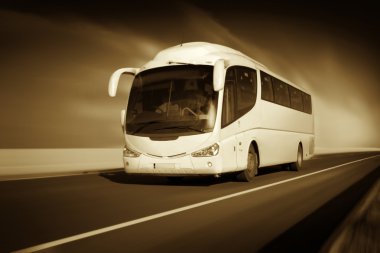 Bus in motion on the highway, monochromatic clipart