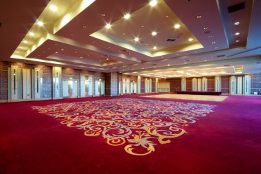 Huge Hall interior with red carpet and seiling with lights in Hotel clipart