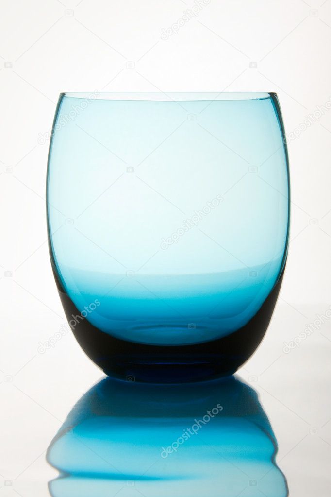 Empty glass reflected on the surface, isolated on white
