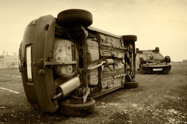 Cars turned upside-down, sepia clipart