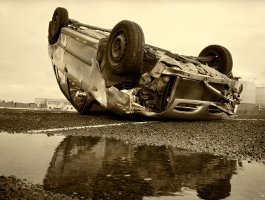 Car turned upside-down, sepia clipart