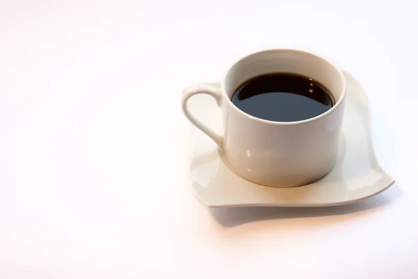 白い背景の上にコーヒーのカップ — ストック写真