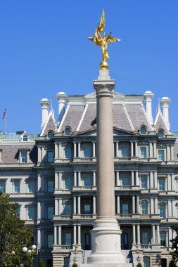 Eisenhower Executive Office Building with First Division Monumen clipart