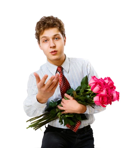 Молодой человек с розами — стоковое фото