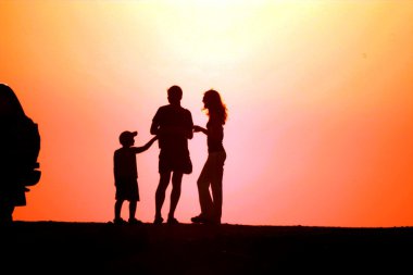 Family on sundown clipart