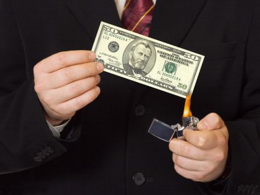 Hands and burnning money clipart