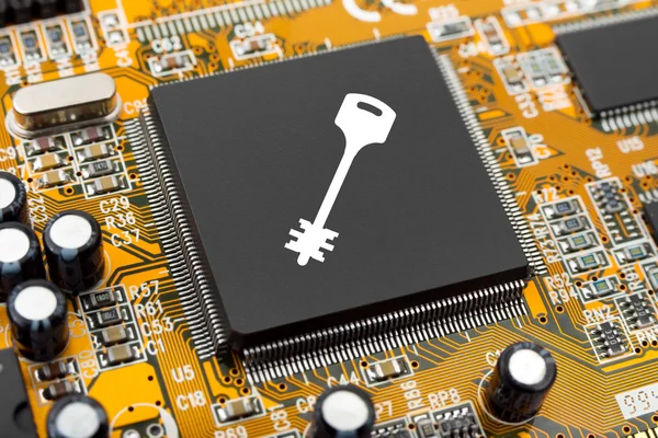 Key on computer chip — Stock Photo, Image
