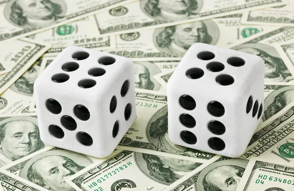 Two dices on money background — Stock Photo, Image