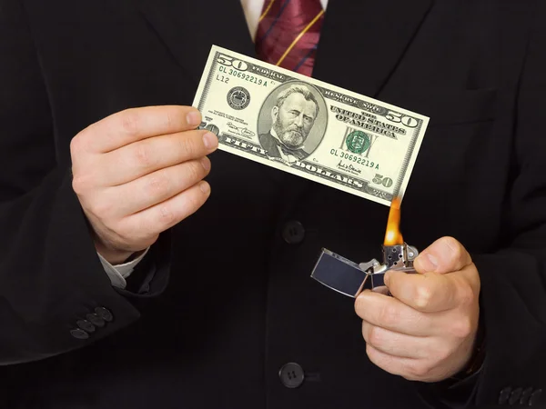 Hands and burnning money — Stock Photo, Image