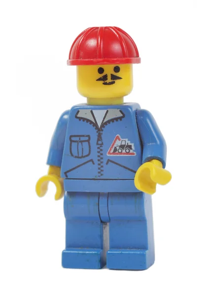 Speelgoed werknemer, bouwer man lego — Stockfoto