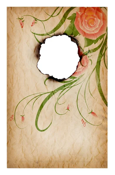 Spalania dziurę w kawałek papieru z dekoracji róże — Zdjęcie stockowe