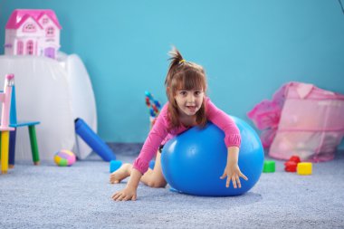 Child on jymnastic ball clipart