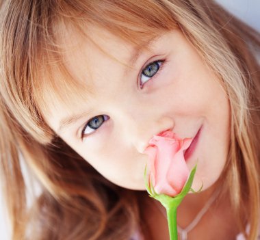 Child holding rose clipart