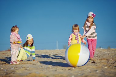 Kids playing at the beach clipart