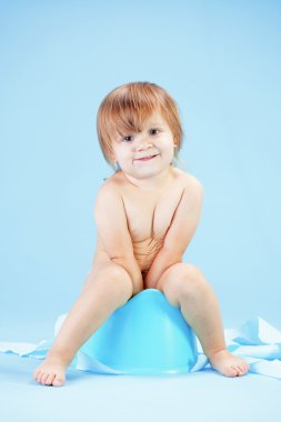 Cute toddler on potty chait clipart