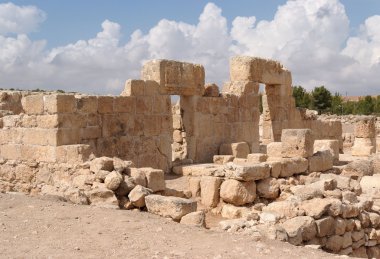 Stone entrance and wall of ancient ruined temple clipart