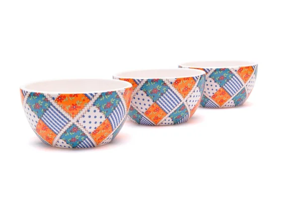 Row of porcelain bowls isolated — Stock Photo, Image