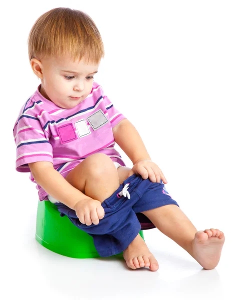 A boy is sitting on the pot — Stock Photo, Image