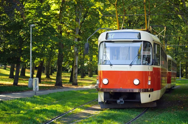 stock image Old red tram in Prague. Focus on the tram