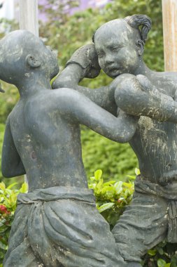 Fighting girls sculpture clipart