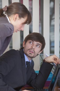 Man surprised by woman at work clipart