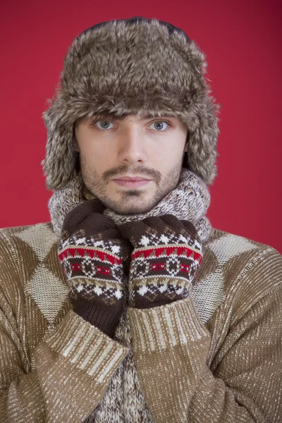 Man in fur hat and sweater — Stock Photo, Image