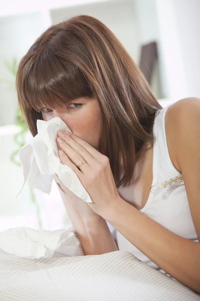 Sick woman with handkerchief — Stock Photo, Image