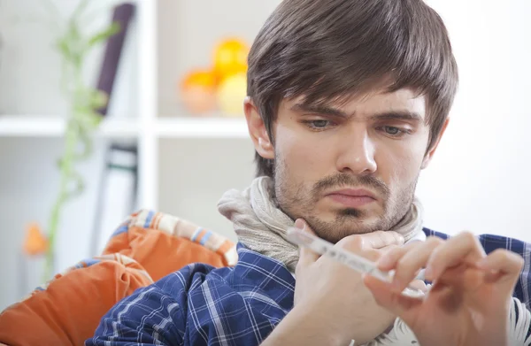 Sick man with thermometer — Stock Photo, Image