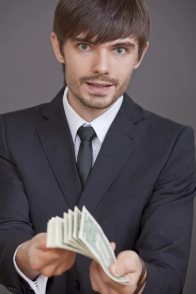 Hombre con montón de dólares — Foto de Stock