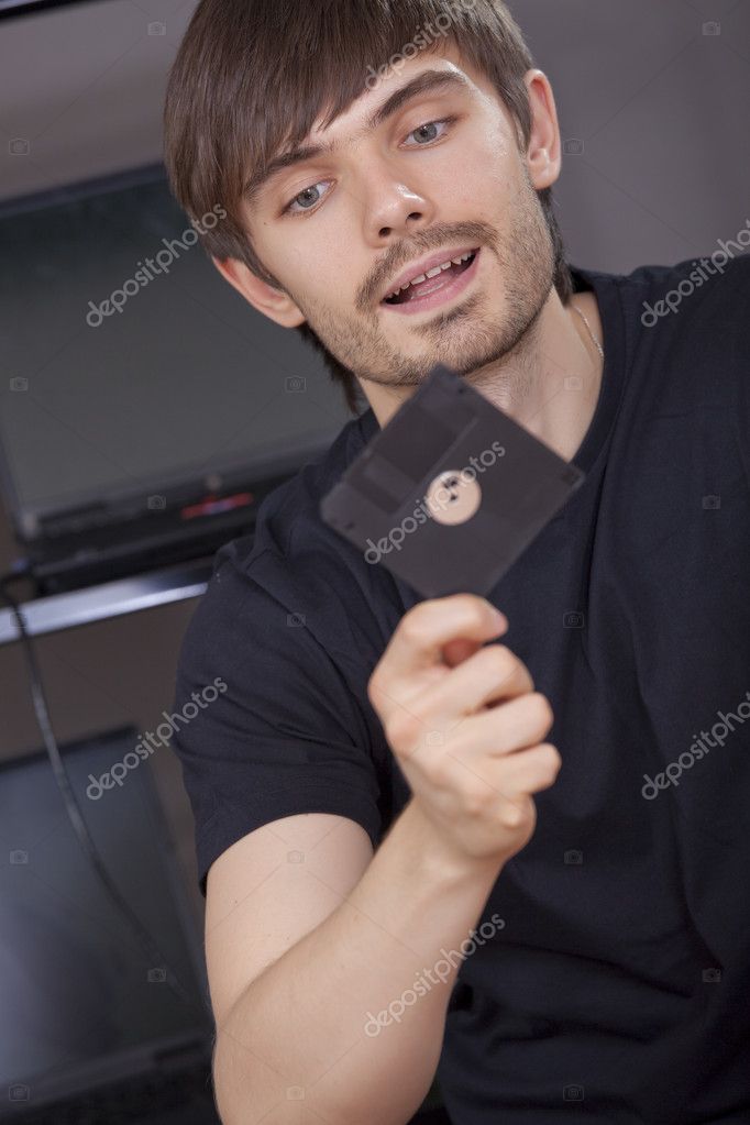 Computer Hacker Holding Floppy Disk His Hand Stock Photo by