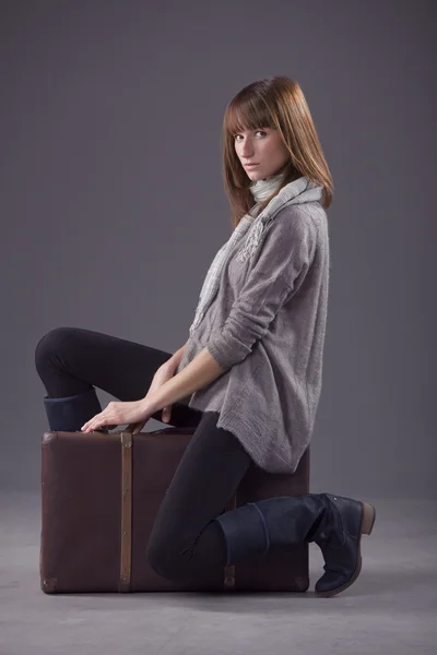 Sad woman with suitcase — Stock Photo, Image