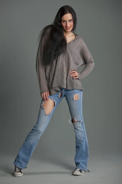 Fashionable Woman Trendy Woman Denim Jeans Holes Grey Background — Stock Photo, Image