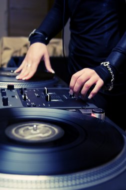 Female rnb deejay playing turntables clipart