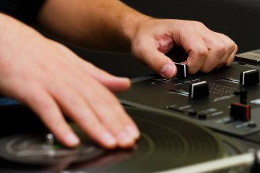 Hip-hop DJ scratching the vinyl clipart