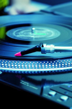 Turntable playing vinyl record clipart