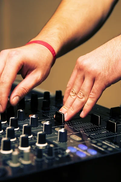 stock image DJ adjusting music level