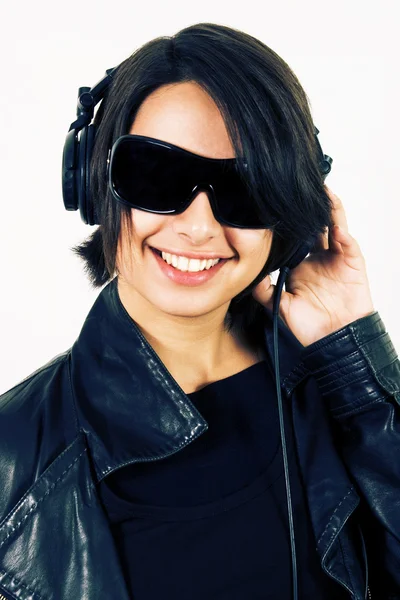 Joven chica sonriente en auriculares —  Fotos de Stock