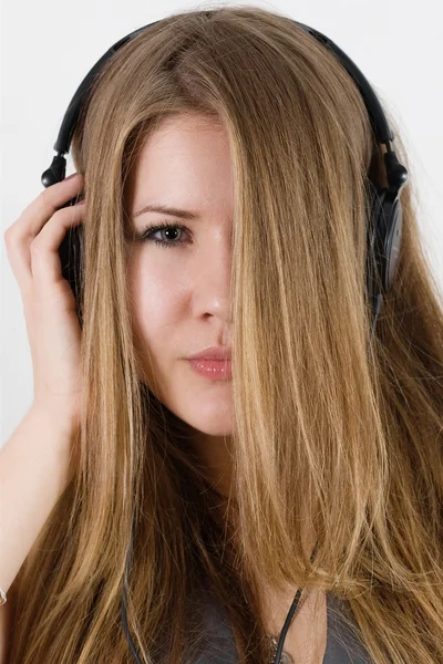 Young pretty girl in headphones — Stock Photo, Image