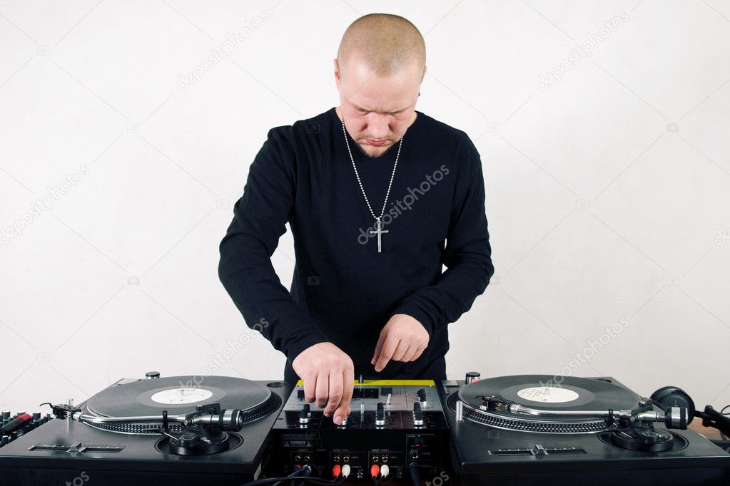 Bold hip-hop DJ mixing vinyl