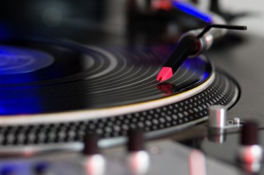 Turntable playing vinyl disc clipart