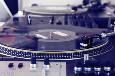 Turntable playing vinyl music record clipart