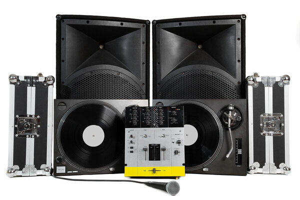 Travel cases, turntables, professional mixing controller, vocal microphone and speakers on white background