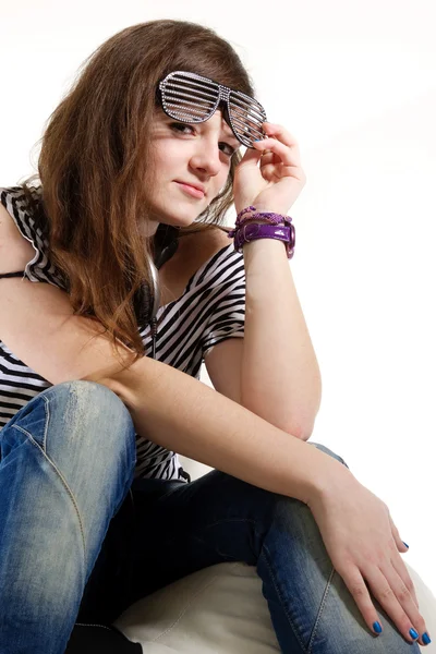 Girl DJ sitting with headphones on her neck — Stock Photo, Image